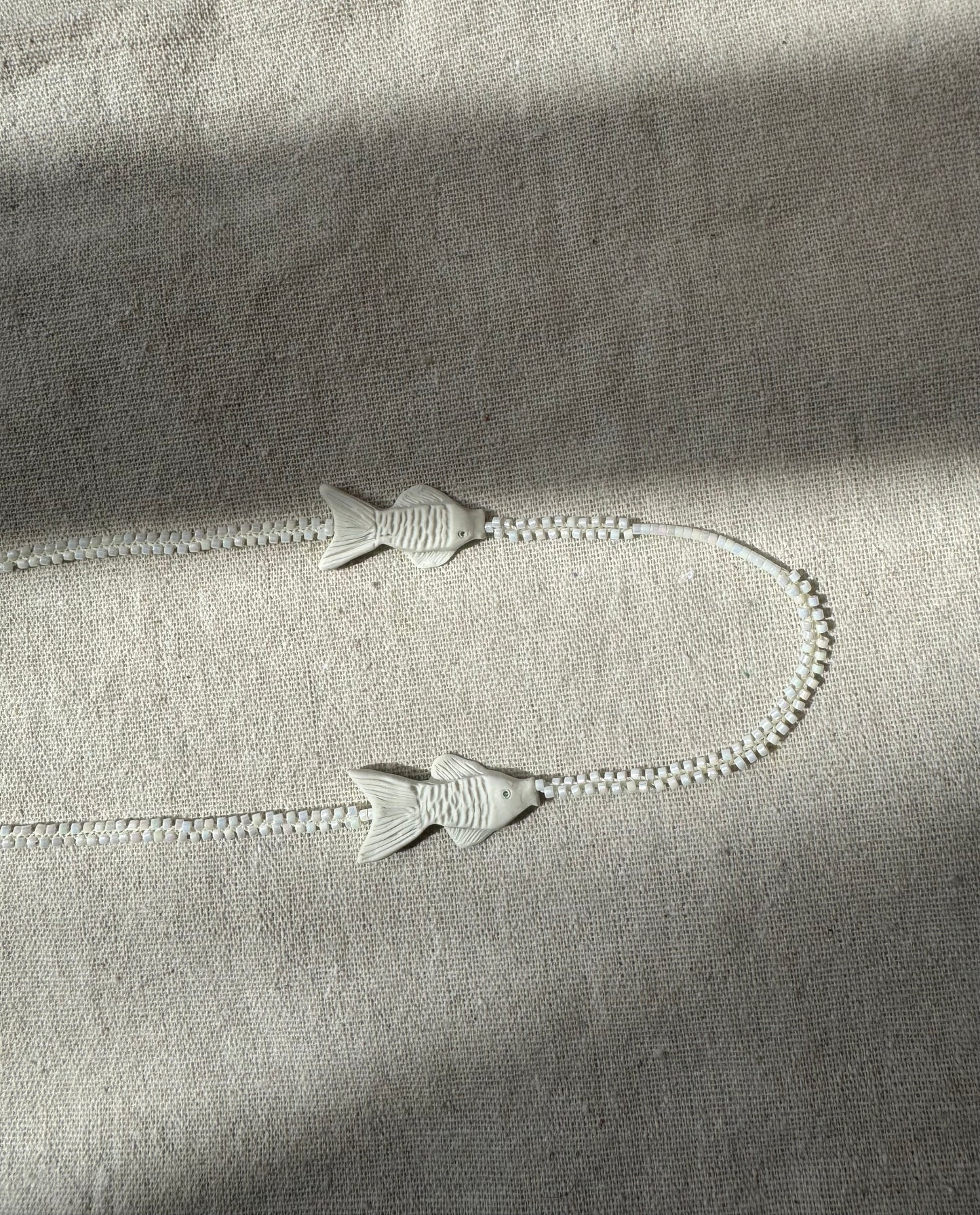 C.River fish necklace, symbiosis