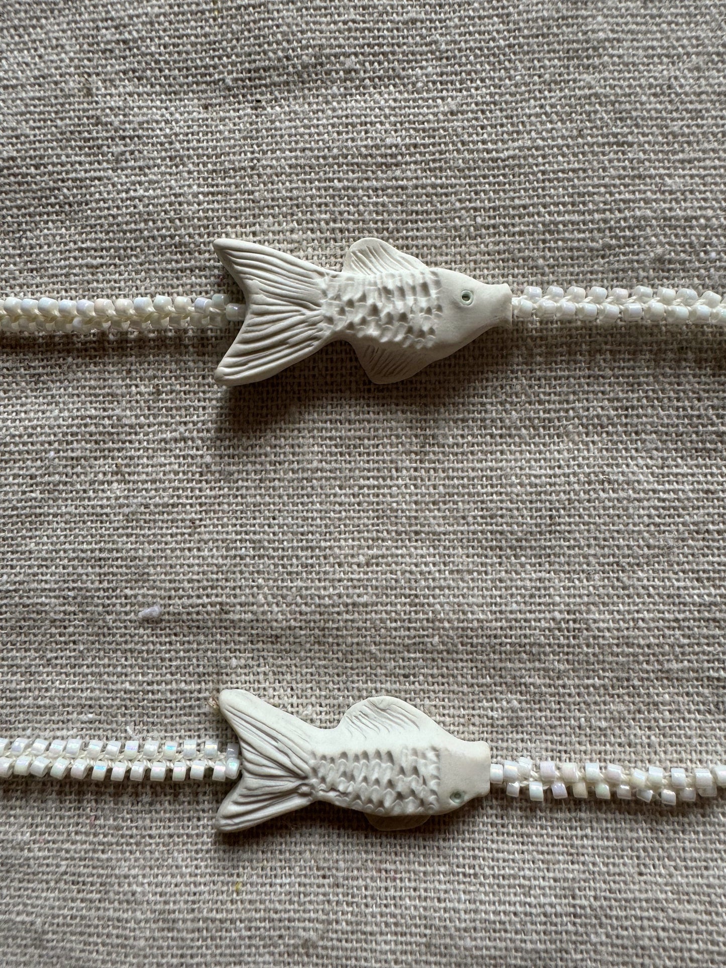 C.River fish necklace, symbiosis